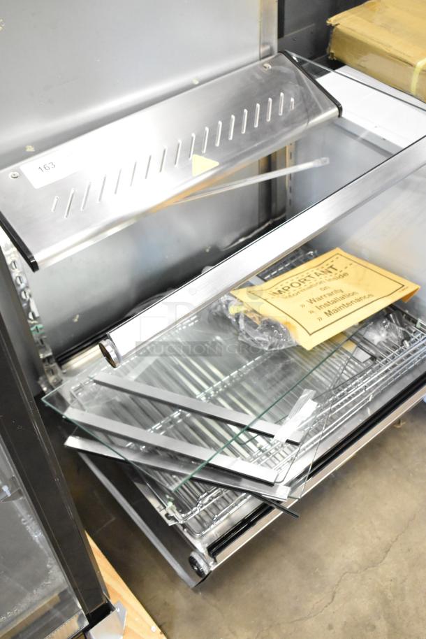 ServIt 423HDM26SA 26" heated display case, 3 shelves, sliding doors, 120V, new with dents, metal and glass parts visible.