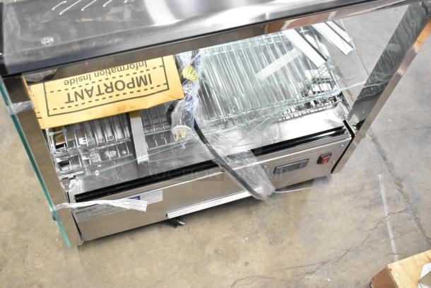 Brand new ServIt 423HDM26SA 26" heated display case; 3 shelves, sliding doors. Scratch and dent. 120V, 1 phase.