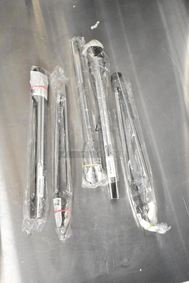 Brand new kitchen tools including China cap strainers and fry baskets in packaging. Some items marked as scratch and dent.