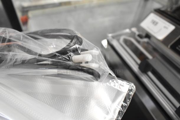 Brand new Galaxy GVME16SS vacuum packaging machine with 16" seal bar, roll cutter, dual piston pump, in packaging.