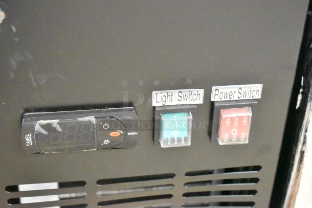 Close-up of Avantco 178UBB72GHC bar fridge controls. Labeled light and power switches, digital display.