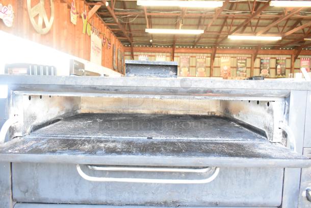 Blodgett 981 commercial natural gas pizza oven, 2 deck, 50,000 BTU, well-used condition, stainless steel exterior.