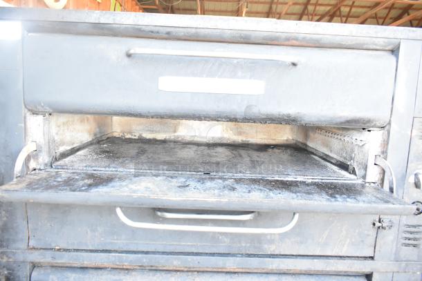 Blodgett 981 commercial 2-deck pizza oven, natural gas, 50,000 BTU, used condition, open door view showing interior deck.
