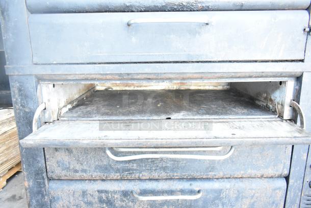 Blodgett 981 commercial natural gas pizza oven, 2-deck, 50,000 BTU. Used, visible wear on exterior and interior surfaces.