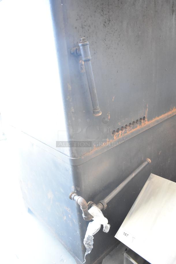 2 Blodgett 981 commercial gas pizza ovens, 50,000 BTU, dual deck. Visible metal pipes and wear indicate used condition.