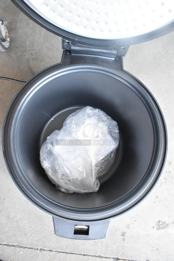 Brand new Galaxy 177RWGB90 electric rice warmer, 90 cup capacity, 120V, 1 phase. Interior view shows packaging, minor scratches visible.