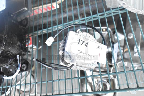 Brand new Avantco 17810032 fan motor with visible auction tag "174." Scratch and dent condition.