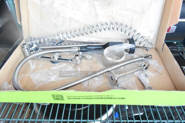 Brand new Regency 600PRW8X scratch and dent wall-mounted pre-rinse faucet with 1.15 GPM, 8" centers, 44" hose in box.