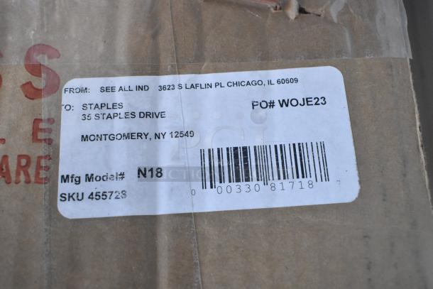 Label on cardboard box addressed to Staples, including PO# WOJE23, Mfg Model# N18, and SKU 455723.