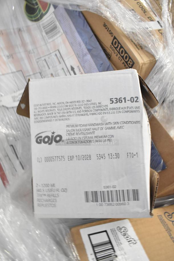 Box containing GoJo foam handwash with labels showing model 5361-02 and expiry 10/2028, part of a scratch and dent auction.