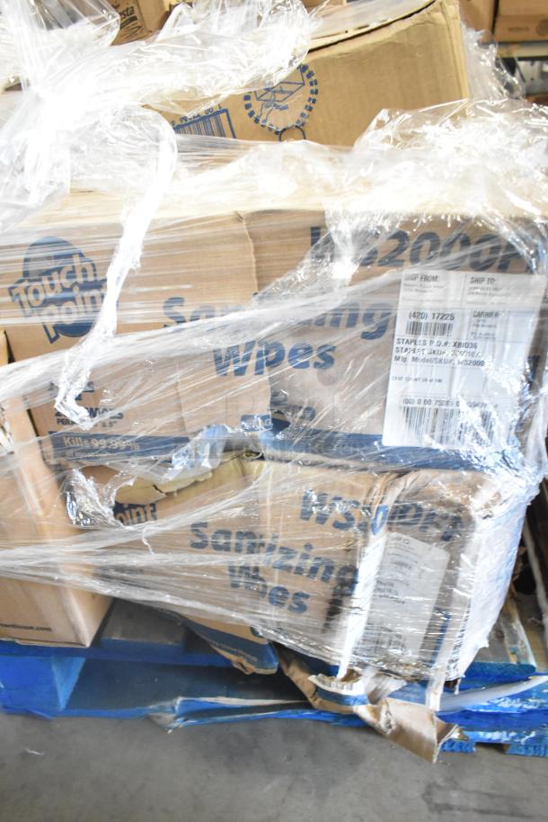 Pallet of scratch and dent items; includes Touch Point sanitizing wipes and boxes, wrapped in plastic, visible labels.