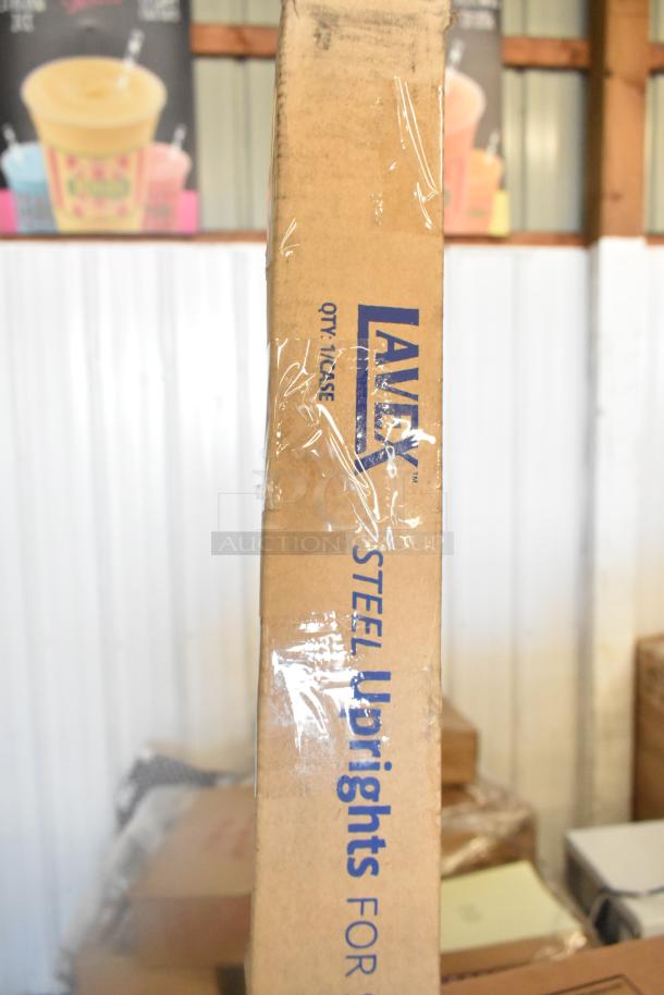 Cardboard box labeled "LAVE ST steel uprights" containing brand new scratch and dent items including various components.