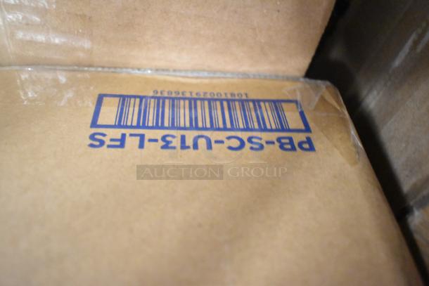 Cardboard box with blue barcode and markings PB-SC-U13-LFS, part of auction lot including scratch and dent items.