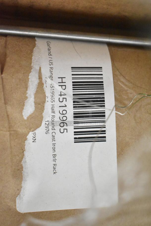 Label on a box showing barcode and text: "Garland US Range 4519965 Half Round Cast Iron Brl Rack."