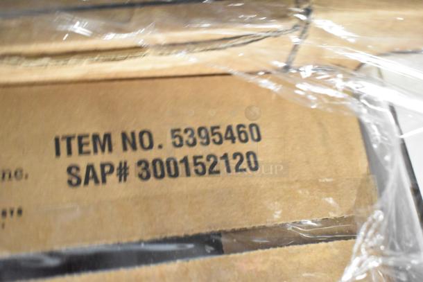 Cardboard box with visible markings: "Item No. 5395460, SAP# 300152120," indicating inventory details. Box is wrapped in plastic.