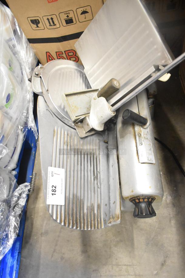 Hobart 1612 commercial countertop meat slicer, 115 volts, 1 phase, visible usage wear, model label on housing.