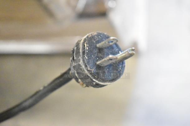 Power plug for Hobart 1612 commercial meat slicer, 115 volts, single phase. Visible wear on plug, indicating use.