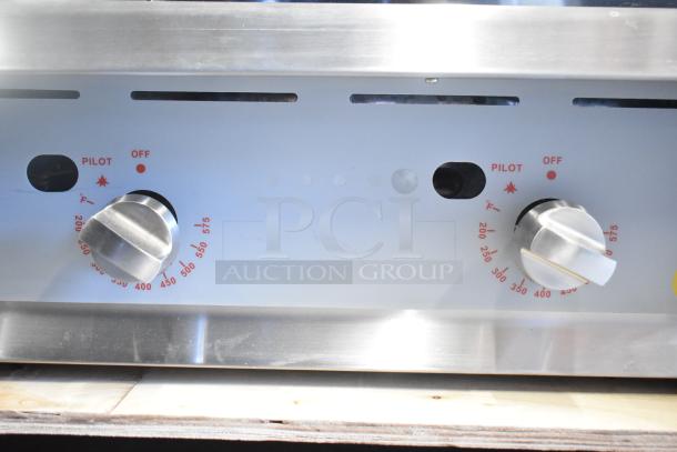 BRAND NEW Cooking Performance Group 48" Gas Griddle, model 351GTCPG48NL, with flame failure protection, thermostatic controls.