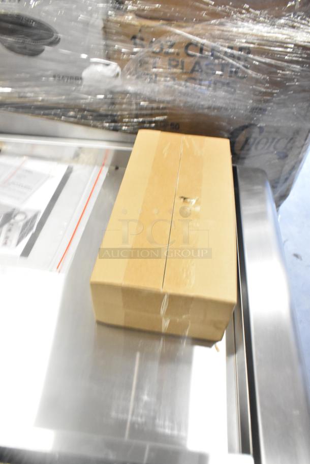 Brand new Cooking Performance Group 48" gas griddle in packaging, model 351GTCPG48NL, 120,000 BTU, thermostatic controls.