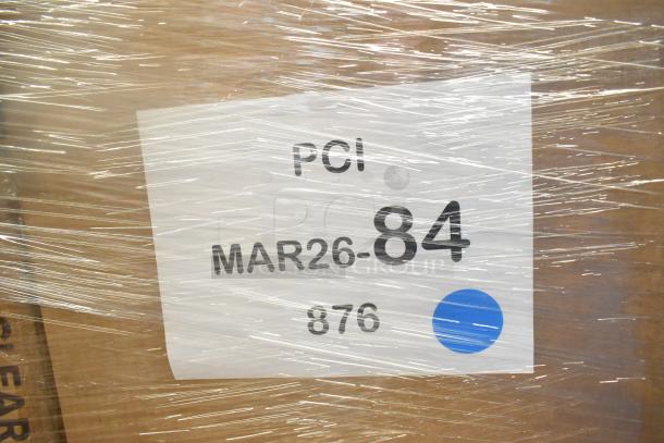 Close-up of a wrapped pallet with a label showing "PCI", "MAR26-84", and "876" on it. 28 scratch and dent items included.