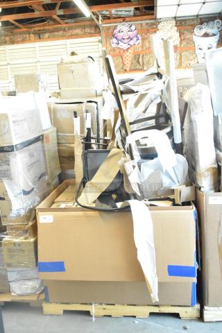 Box of 8 new scratch and dent items including chairs and a hand truck. Various boxes and packaging visible.