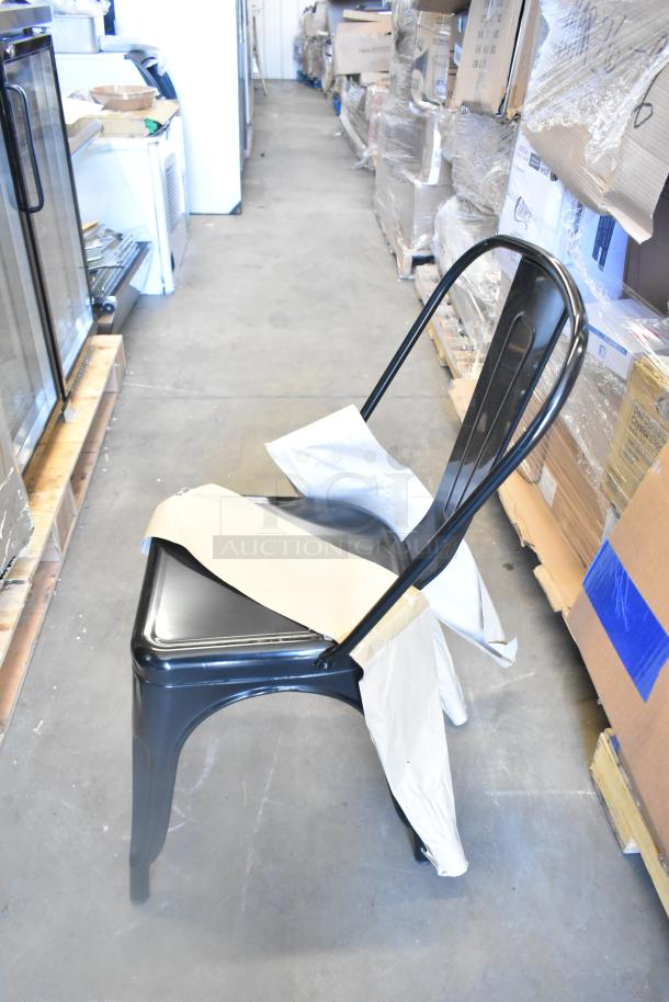 Black metal chair from Cooking Performance Group, model 351GTCPG48NL, brand new with wrapping, slight scratch visible.