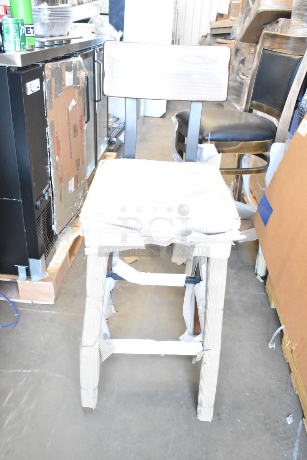 Brand new chair wrapped in protective material, part of an 8-item auction including a Cooking Performance Group model 351GTCPG48NL.