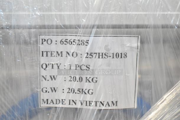Label on wrapped item showing PO: 6565285, Item No: 257HS-1018, 1 piece, N.W: 20 kg, G.W: 20.5 kg, Made in Vietnam.