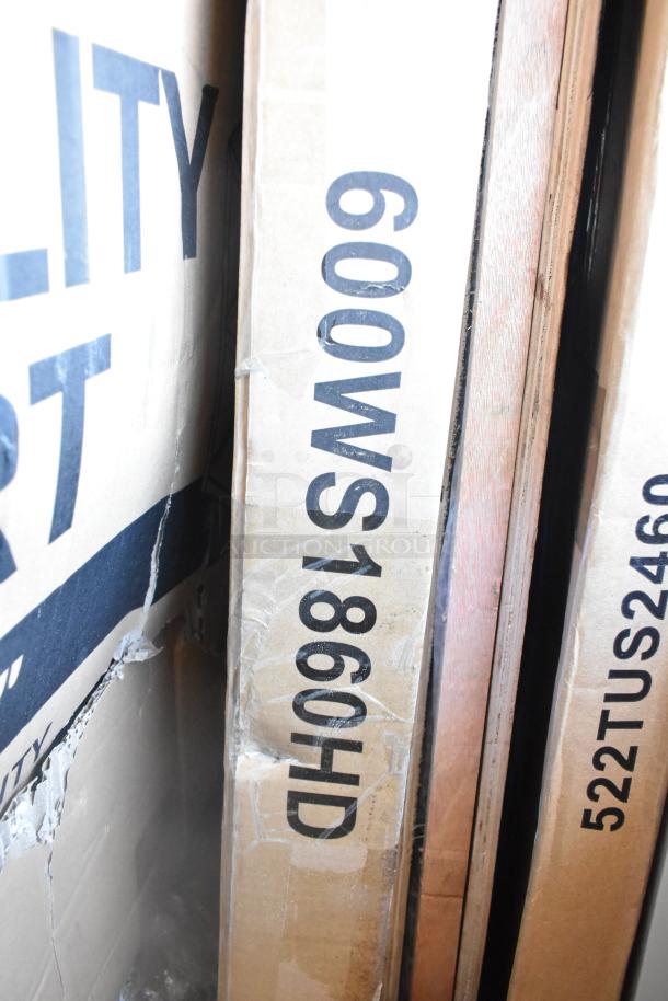 Cardboard boxes showing labels like "600WS1860HD," indicating new scratch and dent items, including Cooking Performance Group models.