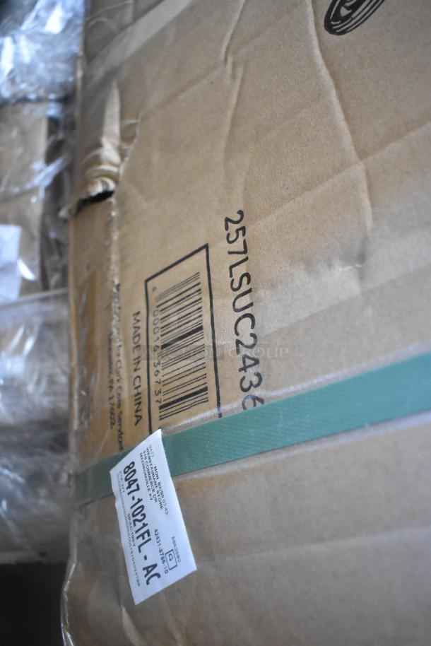 Cardboard box with barcode and text, "Made in China." Features a green strap and a label marked "8047-102FT-AC."