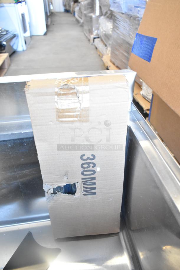 Cooking Performance Group 351GTCPG48NL scratch and dent auction items, including sink and ice bin, shown with cardboard packaging.