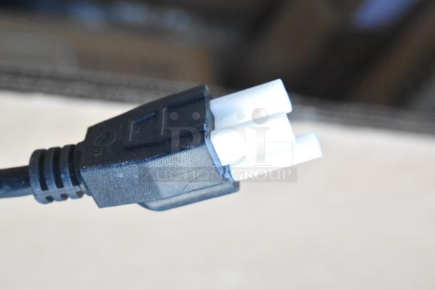 Close-up of a power plug for the Avantco MX10H commercial dough mixer, highlighting electrical connectivity.