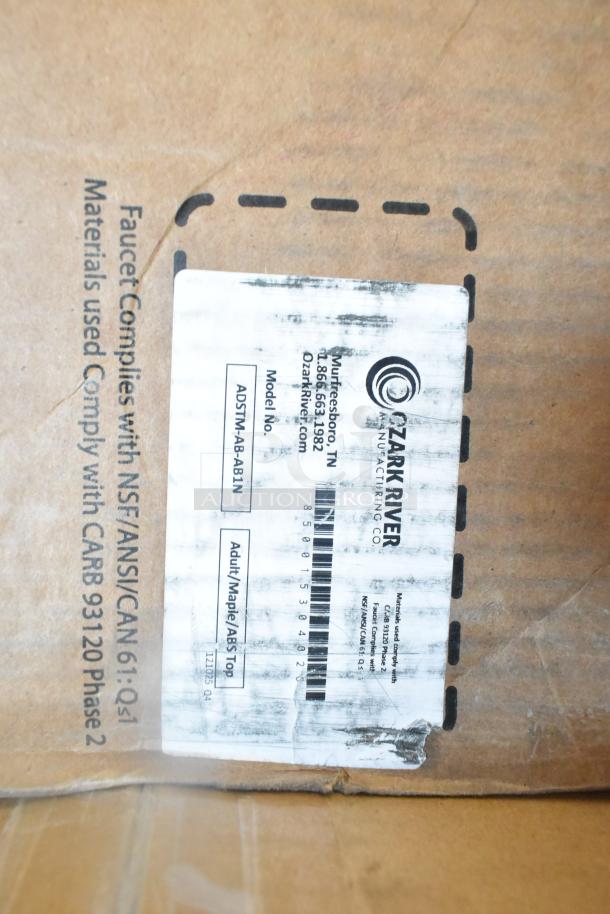 Cardboard box with Ozark River Manufacturing Co. label. Model: ADSTM-AB-AB1N. Marked "Adult Maple/ABS Top." Scratch and dent condition.