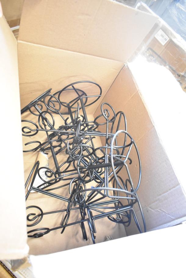 Box of metal display stands, new condition, geometric design, suitable for chafers or tables, auction lot.