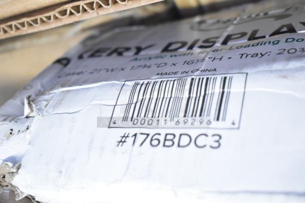 Damaged packaging of items marked with barcode and code #176BDC3, labeled "Made in China," for an auction lot.
