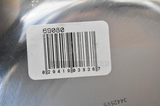 Barcode label on metal surface with numbers 69080 and 029419033367, indicating auction lot of 18 brand new items.