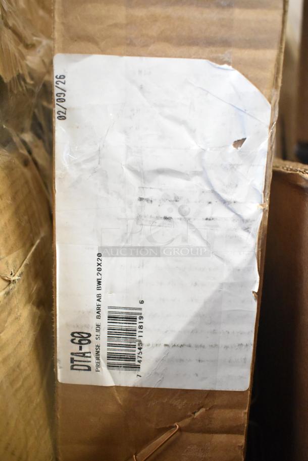 Cardboard box with a damaged label, showing text "PREMISE SLIDE BARFAB BWL 20X20," barcode, and code "DTA-60."