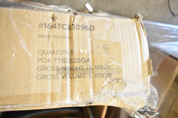 Cardboard box with slight damage, marked "#164TCB3096D," "Made in China," gross weight 15.90kgs, gross volume 0.070CBM.