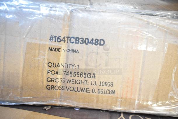 Cardboard box with label "#164TCB3048D, Made in China, Quantity: 1, PO#: 7455565GA, Weight: 13.10kgs, Volume: 0.061CBM".