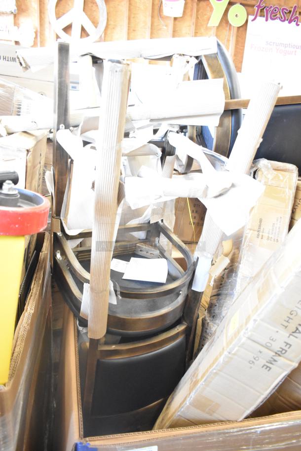 Auction lot of 8 new scratch and dent items, including chairs and outdoor table, in original packaging.