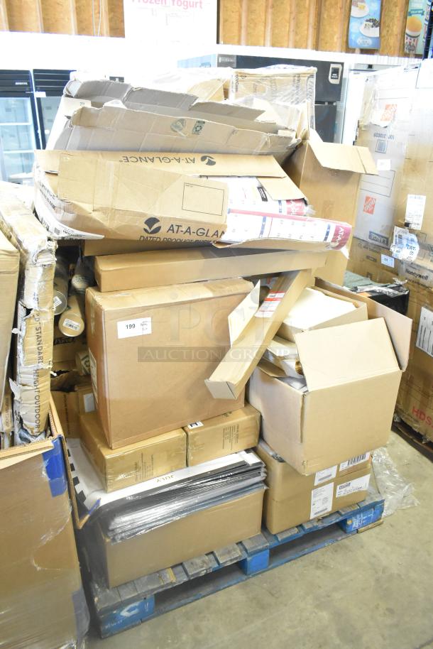 Stack of new scratch and dent items on pallets, including merchandise bags, folders, floor stand dispensers, and Dixie napkins, in original packaging.