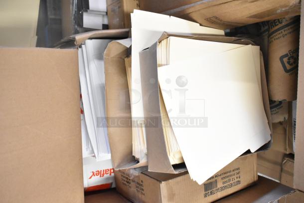 Brand new scratch and dent items, including merchandise bags, folders, and a dispenser floor stand in boxes.