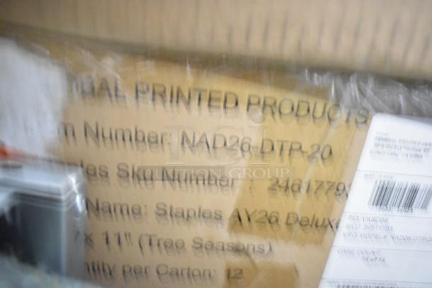 Box containing 20 scratch and dent items, including merchandise bags, folders, dispenser floor stand, and Dixie napkins.