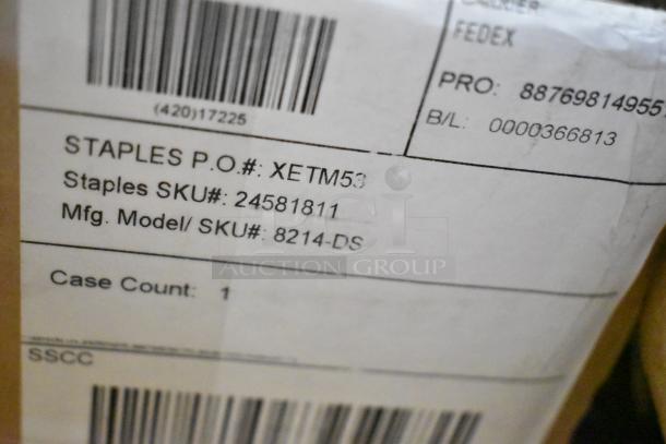 Box label showing Staples P.O. #XETM53, SKU #24581811, Model #8214-DS, case count 1 for scratch and dent items.