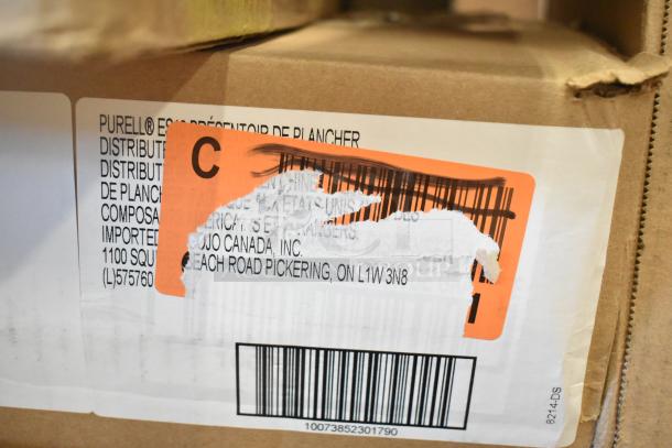 Box with a partially torn label showing shipping info for Cojo Canada, Inc., and barcodes. Includes Purell dispenser floor stand.