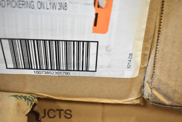 Cardboard box showing barcode 10073852301790 and label marked 8214-DS. Part of auction lot with scratch and dent items.