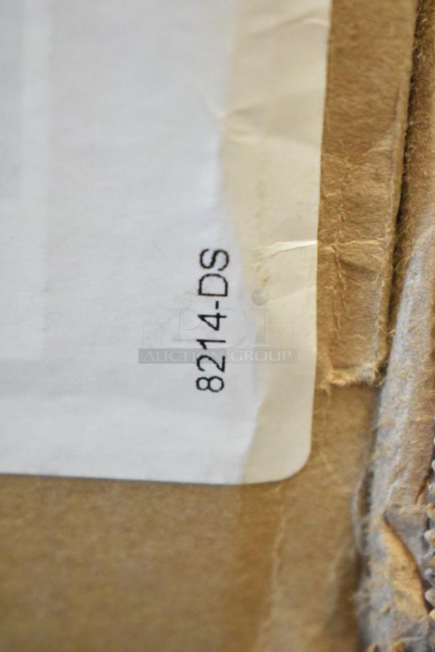 Close-up image of a white label on a brown cardboard box featuring the text "8214-DS."