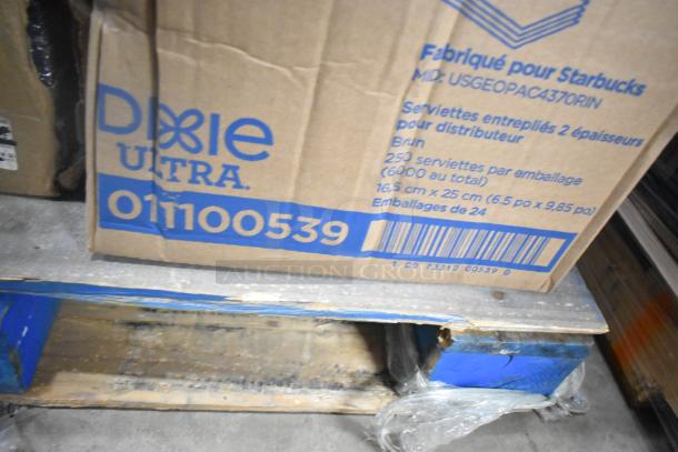 Cardboard box labeled Dixie Ultra with product code 01100539, containing 250 napkins per pack, on a warehouse floor. Scratch and dent condition.