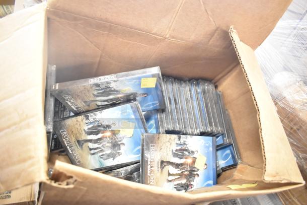 A box of "Rogue One" DVDs, labeled at $3 each, viewed from above in original packaging.