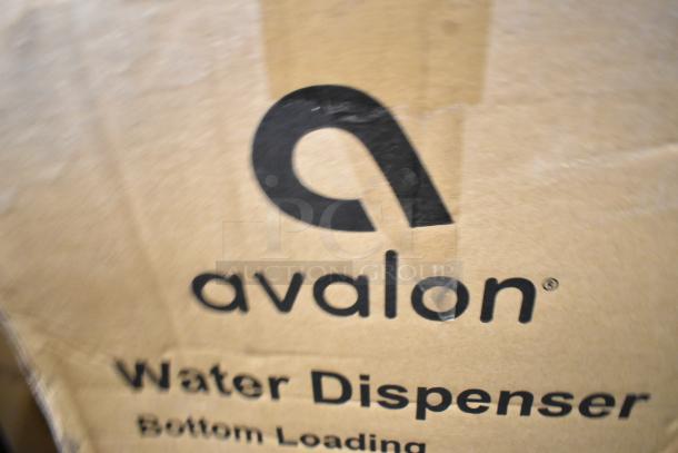 Box of Avalon A4BLWTRCLR bottom loading water cooler, showing brand logo and "Water Dispenser" with minor box wear.